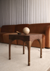Wela Side Table Baan Collection – sculptural side table embodying fluidity in walnut