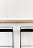 Kolsai Stool close-up of walnut backrest  with black matt powder coat