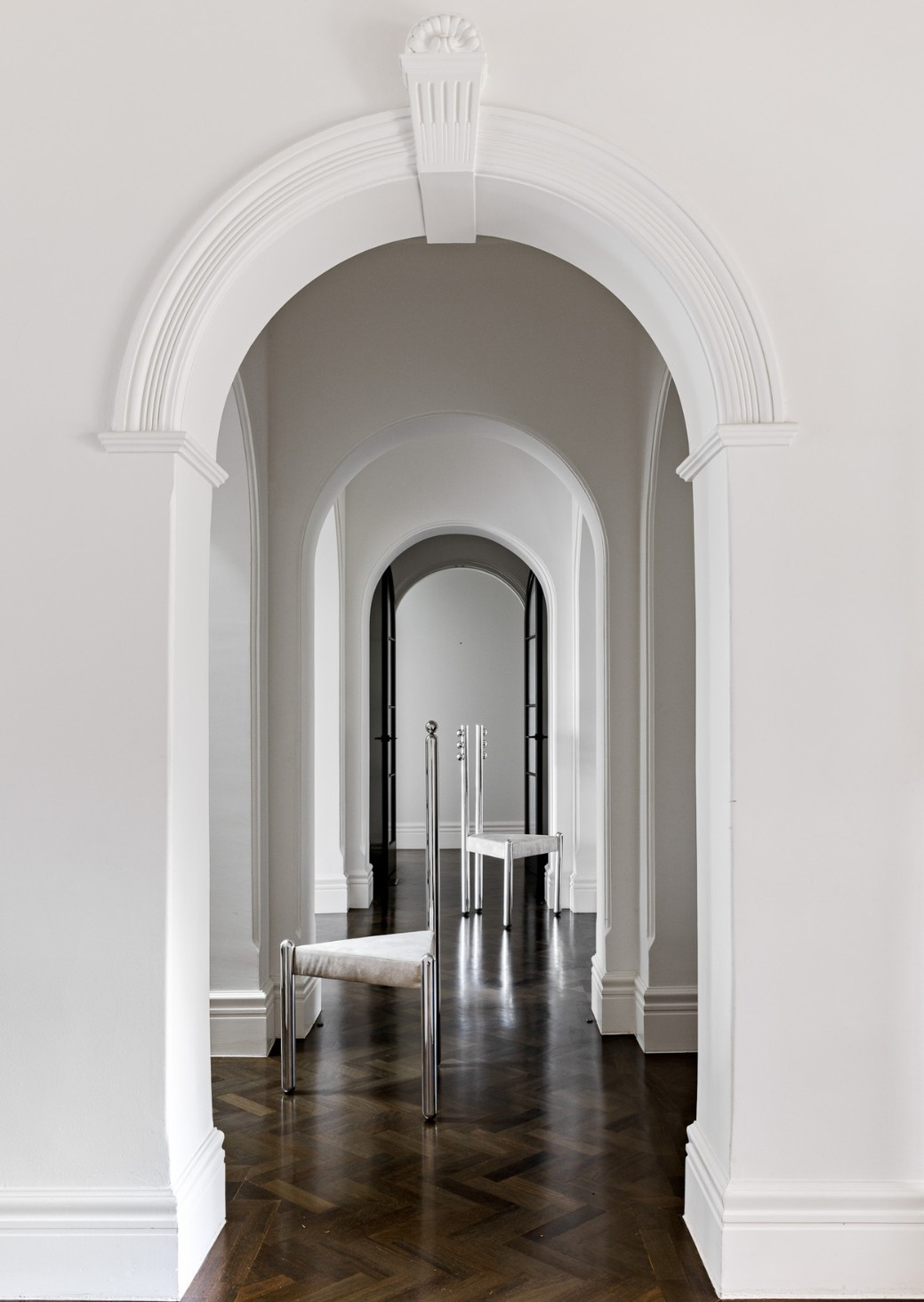 Six Variations Sphere Chair – sculptural chair with polished aluminum frame and cream velvet seat