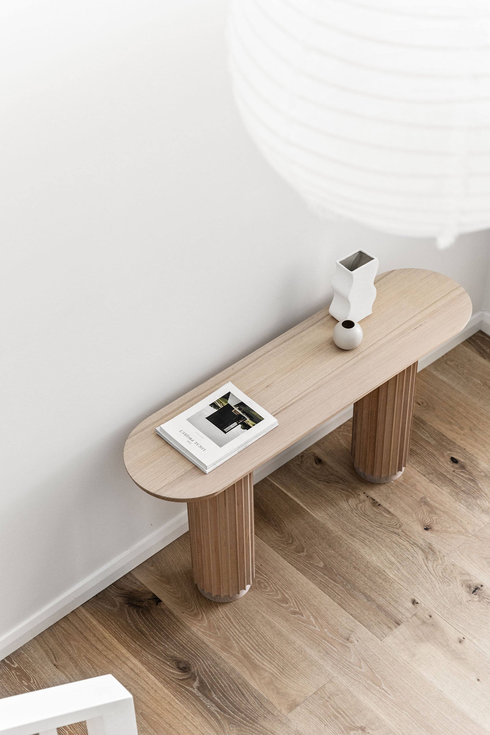 Underline Console – sculptural console table in American Oak with hollow timber bases
