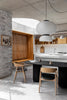 Underline Table – sculptural dining table in Black Oak with hollow cylindrical bases