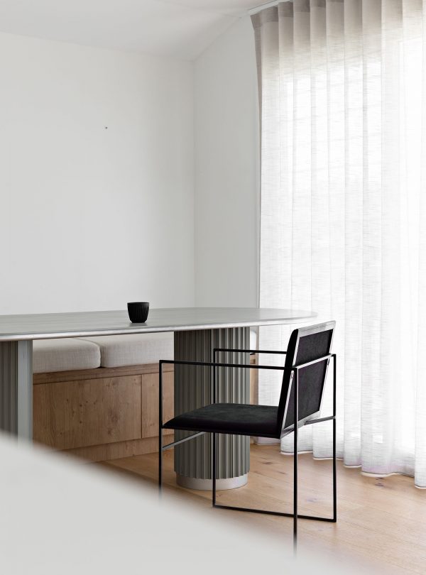 Underline Table triangular timber base in Victorian Ash, seats 8–10