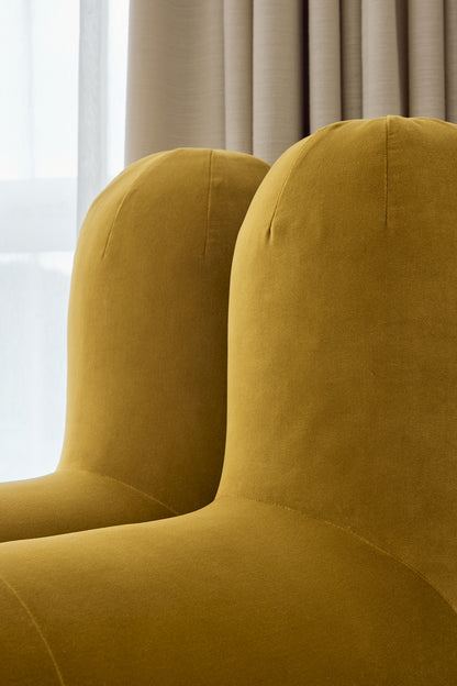 Waldo Chair side view showing adjustable back and plush curve